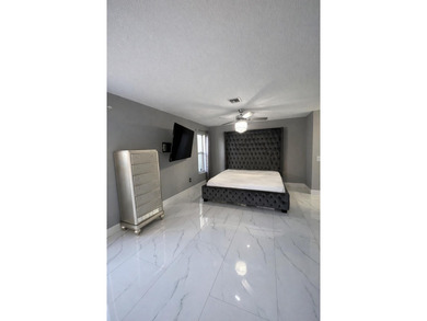 Welcome home! Fully renovated luxury patio home stands far above on Poinciana Golf Club in Florida - for sale on GolfHomes.com, golf home, golf lot