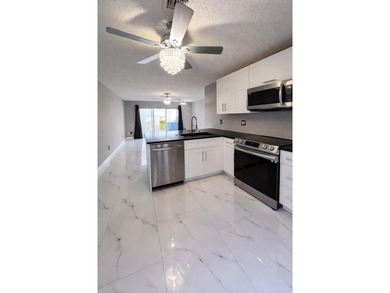 Welcome home! Fully renovated luxury patio home stands far above on Poinciana Golf Club in Florida - for sale on GolfHomes.com, golf home, golf lot