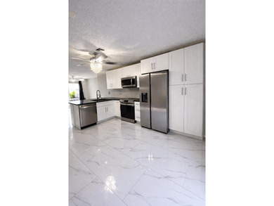 Welcome home! Fully renovated luxury patio home stands far above on Poinciana Golf Club in Florida - for sale on GolfHomes.com, golf home, golf lot