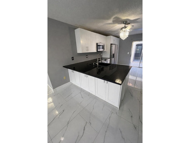 Welcome home! Fully renovated luxury patio home stands far above on Poinciana Golf Club in Florida - for sale on GolfHomes.com, golf home, golf lot