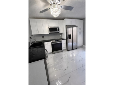 Welcome home! Fully renovated luxury patio home stands far above on Poinciana Golf Club in Florida - for sale on GolfHomes.com, golf home, golf lot