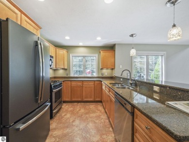 Bass Lake front Quality Condo with sunset views. Tile, Granite on Elk Rapids Golf Club in Michigan - for sale on GolfHomes.com, golf home, golf lot