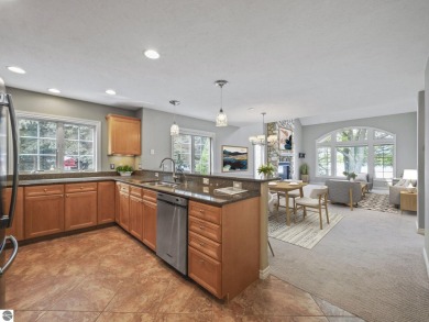 Bass Lake front Quality Condo with sunset views. Tile, Granite on Elk Rapids Golf Club in Michigan - for sale on GolfHomes.com, golf home, golf lot