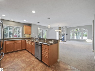 Bass Lake front Quality Condo with sunset views. Tile, Granite on Elk Rapids Golf Club in Michigan - for sale on GolfHomes.com, golf home, golf lot