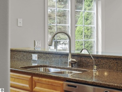 Bass Lake front Quality Condo with sunset views. Tile, Granite on Elk Rapids Golf Club in Michigan - for sale on GolfHomes.com, golf home, golf lot