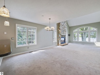 Bass Lake front Quality Condo with sunset views. Tile, Granite on Elk Rapids Golf Club in Michigan - for sale on GolfHomes.com, golf home, golf lot