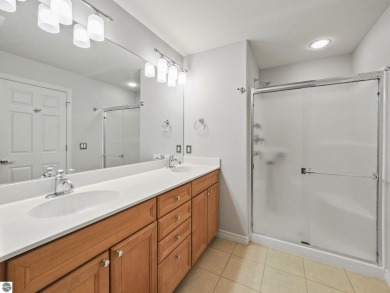 Bass Lake front Quality Condo with sunset views. Tile, Granite on Elk Rapids Golf Club in Michigan - for sale on GolfHomes.com, golf home, golf lot