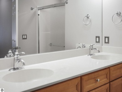 Bass Lake front Quality Condo with sunset views. Tile, Granite on Elk Rapids Golf Club in Michigan - for sale on GolfHomes.com, golf home, golf lot