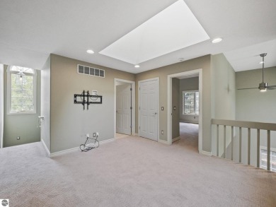 Bass Lake front Quality Condo with sunset views. Tile, Granite on Elk Rapids Golf Club in Michigan - for sale on GolfHomes.com, golf home, golf lot