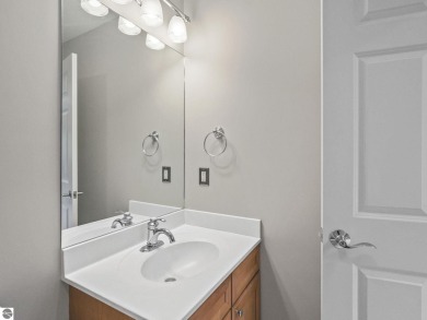 Bass Lake front Quality Condo with sunset views. Tile, Granite on Elk Rapids Golf Club in Michigan - for sale on GolfHomes.com, golf home, golf lot