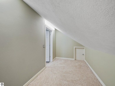 Bass Lake front Quality Condo with sunset views. Tile, Granite on Elk Rapids Golf Club in Michigan - for sale on GolfHomes.com, golf home, golf lot