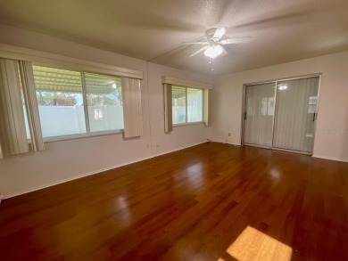 This is a 2-bedroom, 2-bathroom home with a 1-car garage on Mainlands Golf Club in Florida - for sale on GolfHomes.com, golf home, golf lot