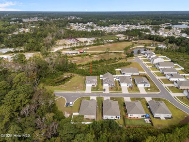 Welcome to this lifestyle-focused two-story home! Step inside on Lennon Hills Golf Course in North Carolina - for sale on GolfHomes.com, golf home, golf lot