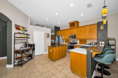 Experience timeless elegance and refined living in this stunning on Lake Jovita Golf and Country Club in Florida - for sale on GolfHomes.com, golf home, golf lot