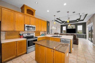 Experience timeless elegance and refined living in this stunning on Lake Jovita Golf and Country Club in Florida - for sale on GolfHomes.com, golf home, golf lot