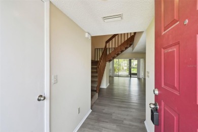 Welcome home! This 2-bedroom, 2.5-bath townhome is nestled in on East Lake Woodlands Country Club in Florida - for sale on GolfHomes.com, golf home, golf lot