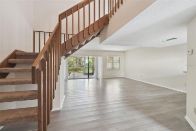 Welcome home! This 2-bedroom, 2.5-bath townhome is nestled in on East Lake Woodlands Country Club in Florida - for sale on GolfHomes.com, golf home, golf lot