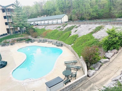 Welcome to your new lakefront getaway at Bristol Bay Condos! on Seasons Ridge At Four Seasons in Missouri - for sale on GolfHomes.com, golf home, golf lot