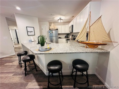 Welcome to your new lakefront getaway at Bristol Bay Condos! on Seasons Ridge At Four Seasons in Missouri - for sale on GolfHomes.com, golf home, golf lot
