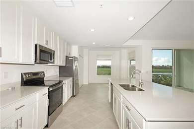 This southwest-facing GROUND FLOOR DiAngelo model, newly built on Panther Run Golf Club in Florida - for sale on GolfHomes.com, golf home, golf lot