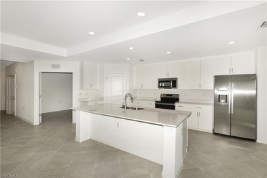 This southwest-facing GROUND FLOOR DiAngelo model, newly built on Panther Run Golf Club in Florida - for sale on GolfHomes.com, golf home, golf lot