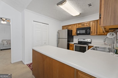 Ideally located in the heart of Peachtree City, this inviting on Canongate At Flat Creek Club in Georgia - for sale on GolfHomes.com, golf home, golf lot