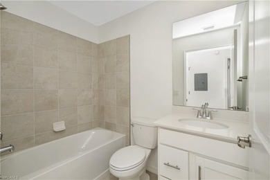 This southwest-facing GROUND FLOOR DiAngelo model, newly built on Panther Run Golf Club in Florida - for sale on GolfHomes.com, golf home, golf lot