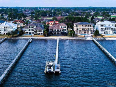Luxury Waterfront Home located in Tiger Point with Dock, Pool on Tiger Point Golf and Country Club in Florida - for sale on GolfHomes.com, golf home, golf lot