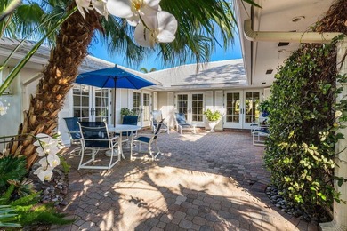 Experience refined lakefront living in this 3-bedroom, 2-bath on Quail Ridge Golf Course and Country Club in Florida - for sale on GolfHomes.com, golf home, golf lot