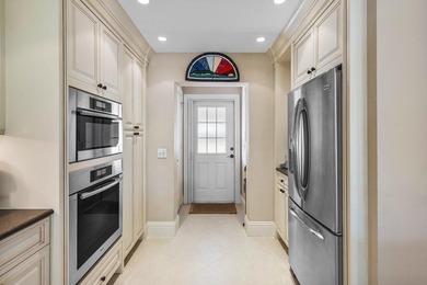 Experience refined lakefront living in this 3-bedroom, 2-bath on Quail Ridge Golf Course and Country Club in Florida - for sale on GolfHomes.com, golf home, golf lot