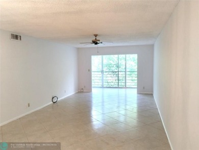 HANDYMAN SPECIAL. QUIET LOCATION CLOSE TO LYONS RD ENTRANCE on Wynmoor Golf Course in Florida - for sale on GolfHomes.com, golf home, golf lot