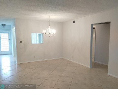 HANDYMAN SPECIAL. QUIET LOCATION CLOSE TO LYONS RD ENTRANCE on Wynmoor Golf Course in Florida - for sale on GolfHomes.com, golf home, golf lot