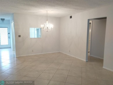 HANDYMAN SPECIAL. QUIET LOCATION CLOSE TO LYONS RD ENTRANCE on Wynmoor Golf Course in Florida - for sale on GolfHomes.com, golf home, golf lot