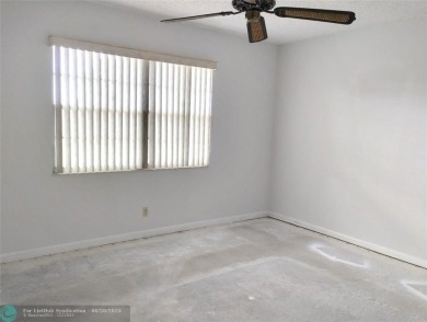 HANDYMAN SPECIAL. QUIET LOCATION CLOSE TO LYONS RD ENTRANCE on Wynmoor Golf Course in Florida - for sale on GolfHomes.com, golf home, golf lot