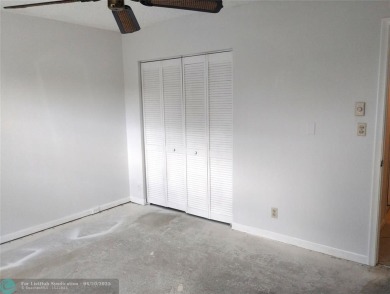 HANDYMAN SPECIAL. QUIET LOCATION CLOSE TO LYONS RD ENTRANCE on Wynmoor Golf Course in Florida - for sale on GolfHomes.com, golf home, golf lot