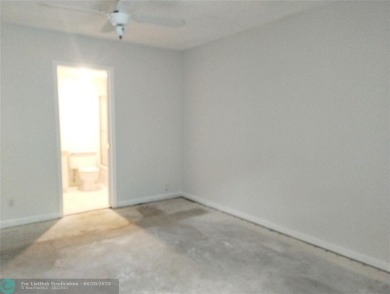 HANDYMAN SPECIAL. QUIET LOCATION CLOSE TO LYONS RD ENTRANCE on Wynmoor Golf Course in Florida - for sale on GolfHomes.com, golf home, golf lot