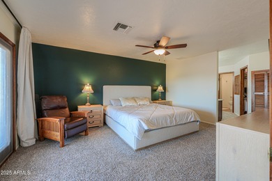 Beautifully maintained 4-bedroom, 2.5-bath home offering 2,572 on Arizona City Golf Club in Arizona - for sale on GolfHomes.com, golf home, golf lot