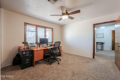 Beautifully maintained 4-bedroom, 2.5-bath home offering 2,572 on Arizona City Golf Club in Arizona - for sale on GolfHomes.com, golf home, golf lot