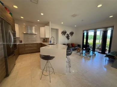 Welcome to this elegant first-floor condominium at The Legends on Weston Hills Country Club in Florida - for sale on GolfHomes.com, golf home, golf lot