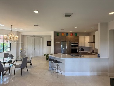 Welcome to this elegant first-floor condominium at The Legends on Weston Hills Country Club in Florida - for sale on GolfHomes.com, golf home, golf lot