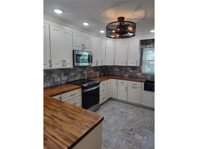 PRICE IMPROVEMENT!!!!You will love this spacious end unit on The Dunedin Country Club in Florida - for sale on GolfHomes.com, golf home, golf lot