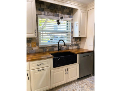 PRICE IMPROVEMENT!!!!You will love this spacious end unit on The Dunedin Country Club in Florida - for sale on GolfHomes.com, golf home, golf lot