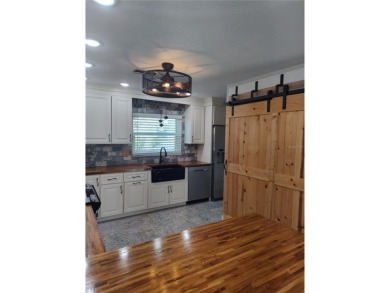 PRICE IMPROVEMENT!!!!You will love this spacious end unit on The Dunedin Country Club in Florida - for sale on GolfHomes.com, golf home, golf lot
