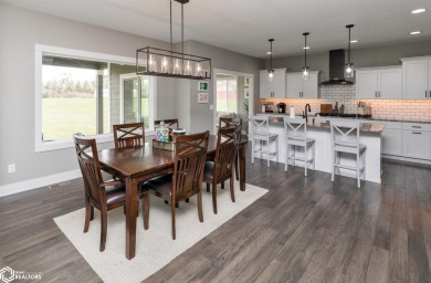 SHOW STOPPER!! Welcome to 1150 Cardinal Drive, a beautifully on Tournament Club of Iowa in Iowa - for sale on GolfHomes.com, golf home, golf lot