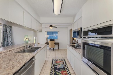 Charming 3-bedroom, 2-bathroom, canal-front home in the highly on Pinemoor West Golf Club in Florida - for sale on GolfHomes.com, golf home, golf lot