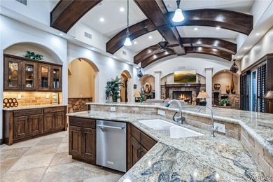 Nearly 6,000 Sq Ft of Purposeful Luxury with Dual Primary Suites on Laughlin Ranch Golf Club in Arizona - for sale on GolfHomes.com, golf home, golf lot