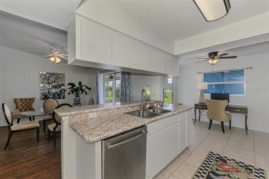 Charming 3-bedroom, 2-bathroom, canal-front home in the highly on Pinemoor West Golf Club in Florida - for sale on GolfHomes.com, golf home, golf lot