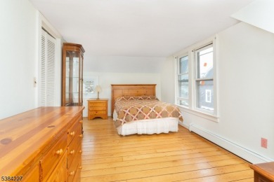 Step into the timeless charm of this Victorian gem in the heart on Mt Tabor Country Club in New Jersey - for sale on GolfHomes.com, golf home, golf lot