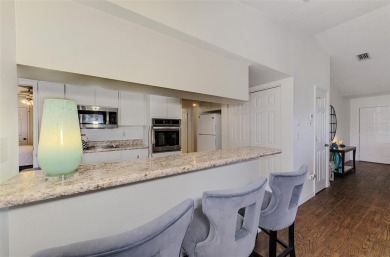 Charming 3-bedroom, 2-bathroom, canal-front home in the highly on Pinemoor West Golf Club in Florida - for sale on GolfHomes.com, golf home, golf lot