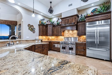 Nearly 6,000 Sq Ft of Purposeful Luxury with Dual Primary Suites on Laughlin Ranch Golf Club in Arizona - for sale on GolfHomes.com, golf home, golf lot